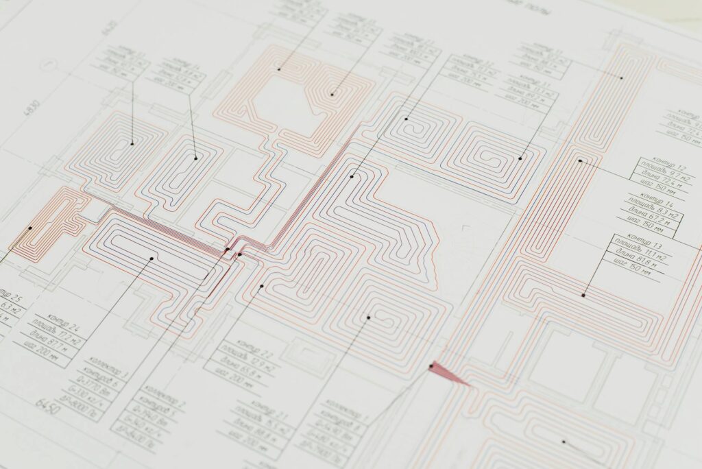 Close-up view of a detailed architectural blueprint with intricate designs and data points.