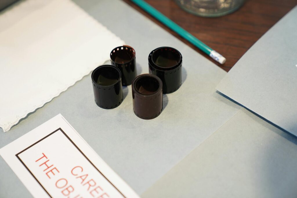 Close-up of film negatives and tools used in vintage photography development.